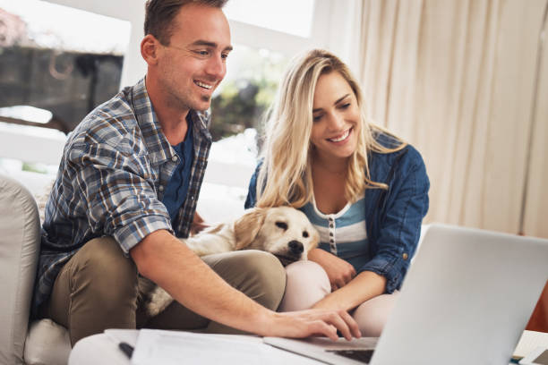 Shot of a young couple doing their finances together at home
